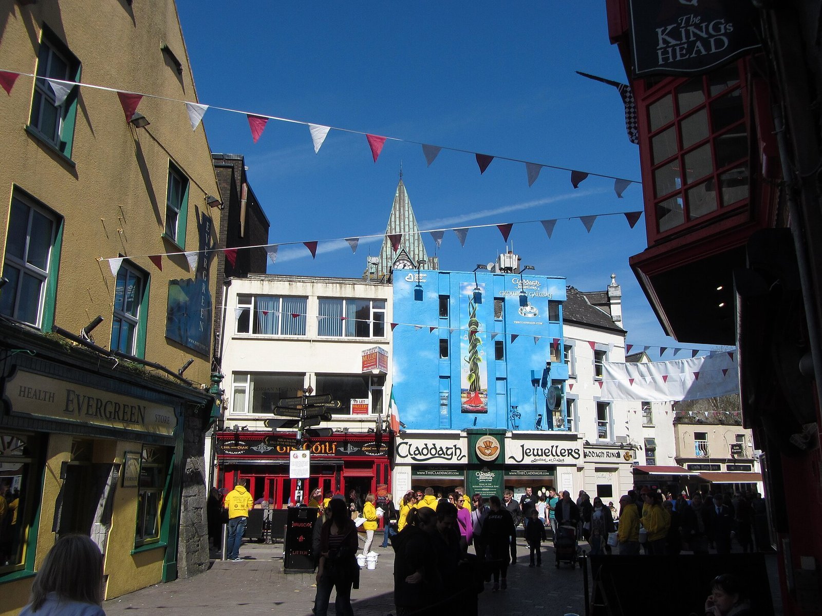 The colourful shopfronts and bunting of Quay Street, Galway