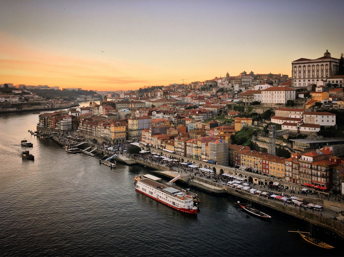 Sunset over the Douro River with boats moored at Ribeira, Porto